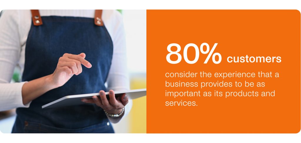 Person in a blue apron using a tablet. Text: "80% of customers consider the experience—enhanced by seamless omnichannel messaging—as important as its products and services.